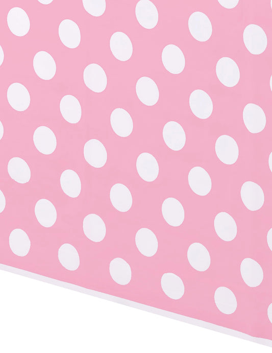 Détail du motif de la nappe décoration rétro rose à pois blancs en plastique