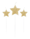 3 bougies sur pic étoiles pour fête paillettes champagne