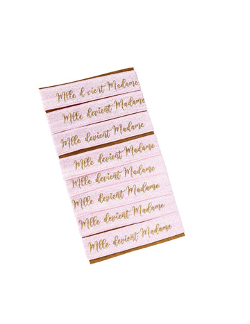 8 růžovo-zlatých náramků ze slečny, která se stává madam