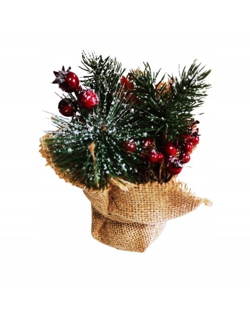 Composition de Noël baies rouges et sapin enneigés pour décoration dans pot en jute