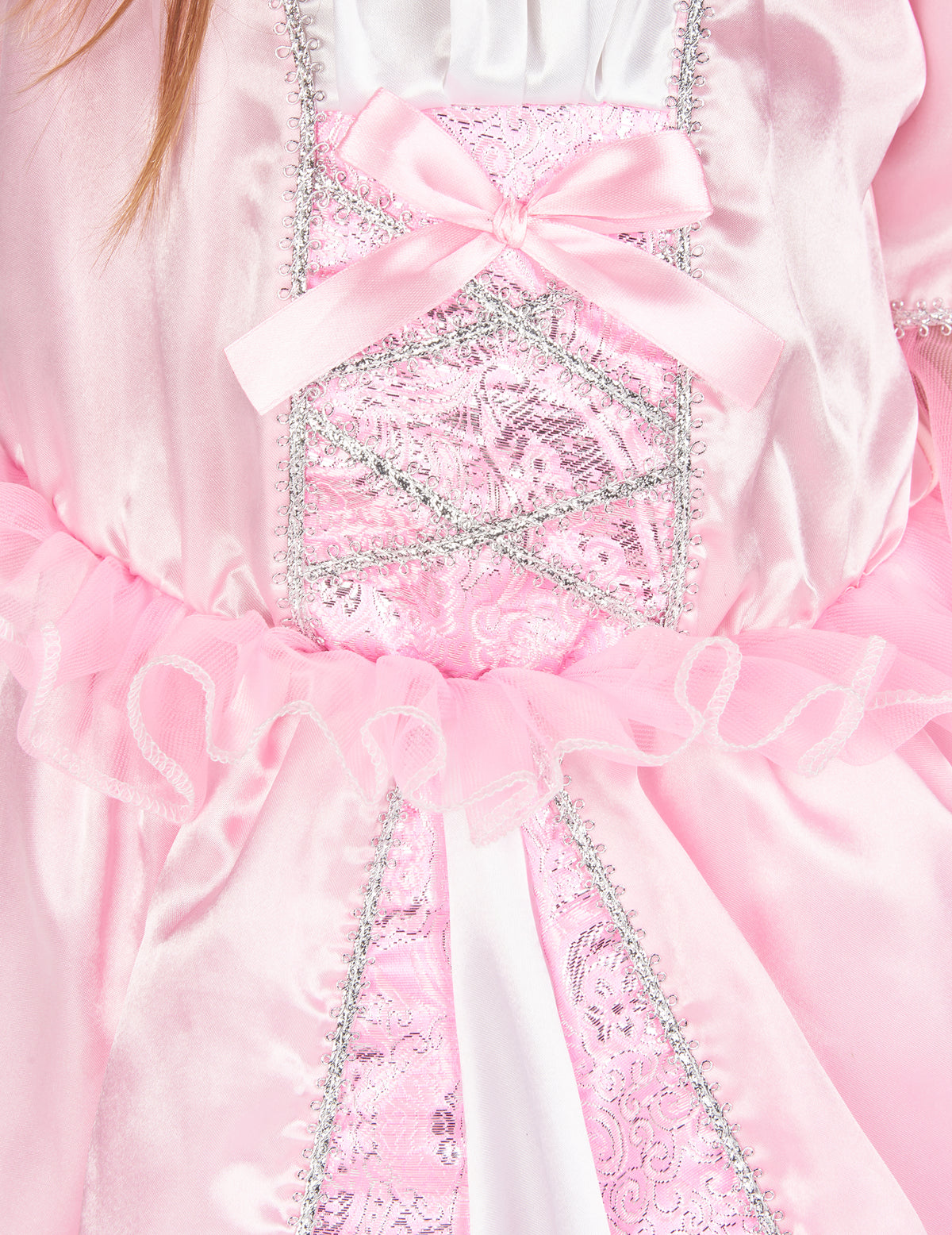 Détail du bustier rose avec nœud et liserés argentés du déguisement de princesse avec couronne à fleurs