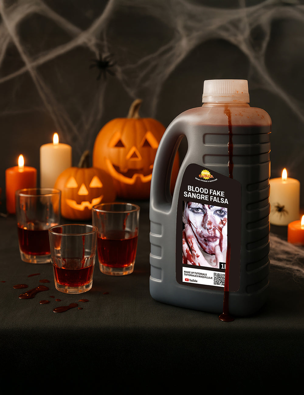Mise en scène avec citrouilles et bougies du faux sang Halloween pour adulte rouge liquide