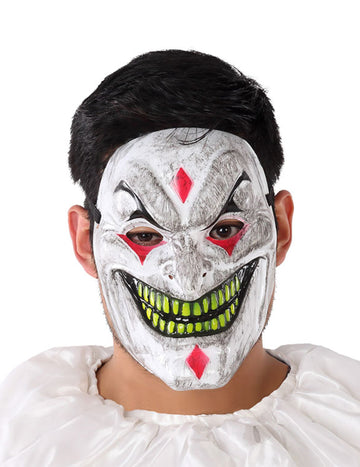 Masque PVC de clown démoniaque pour adulte blanc aux dents vertes et losanges rouges