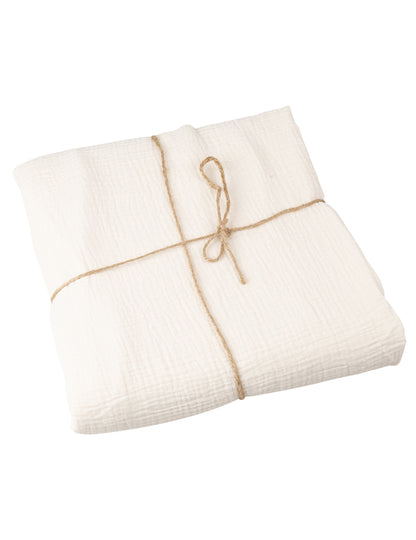 Vue pliée avec ficelle de la nappe en gaze de coton style bohème crème